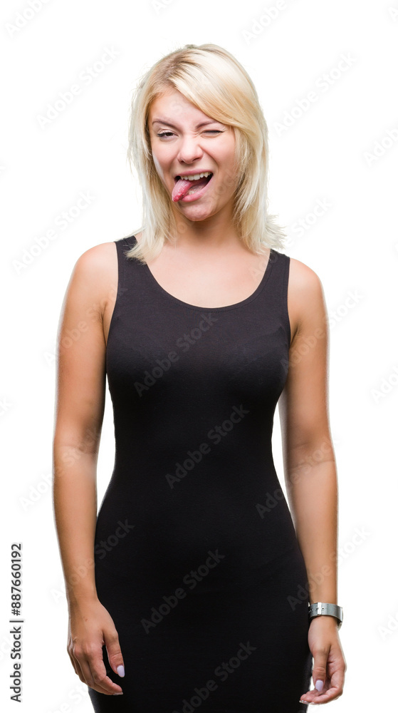 Young beautiful blonde attractive woman wearing elegant dress over isolated background sticking tongue out happy with funny expression. Emotion concept. Young beautiful blonde attractive woman wearing elegant dress over isolated background sticking tongue out happy with funny expression. Emotion concept.