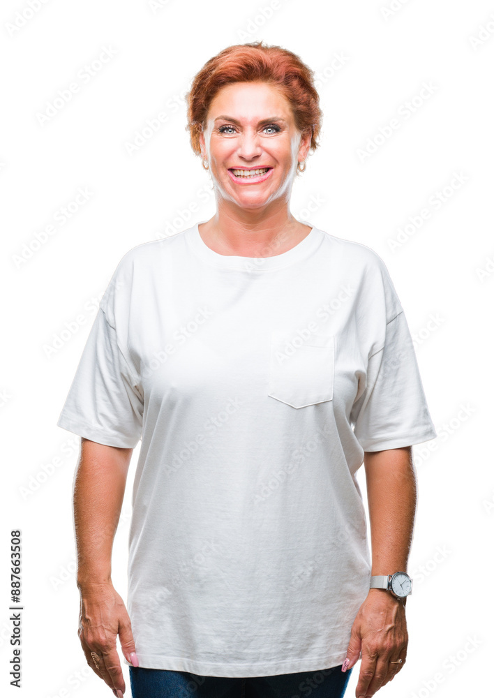 Atrractive senior caucasian redhead woman over isolated background with a happy and cool smile on face. Lucky person. Atrractive senior caucasian redhead woman over isolated background with a happy and cool smile on face. Lucky person.