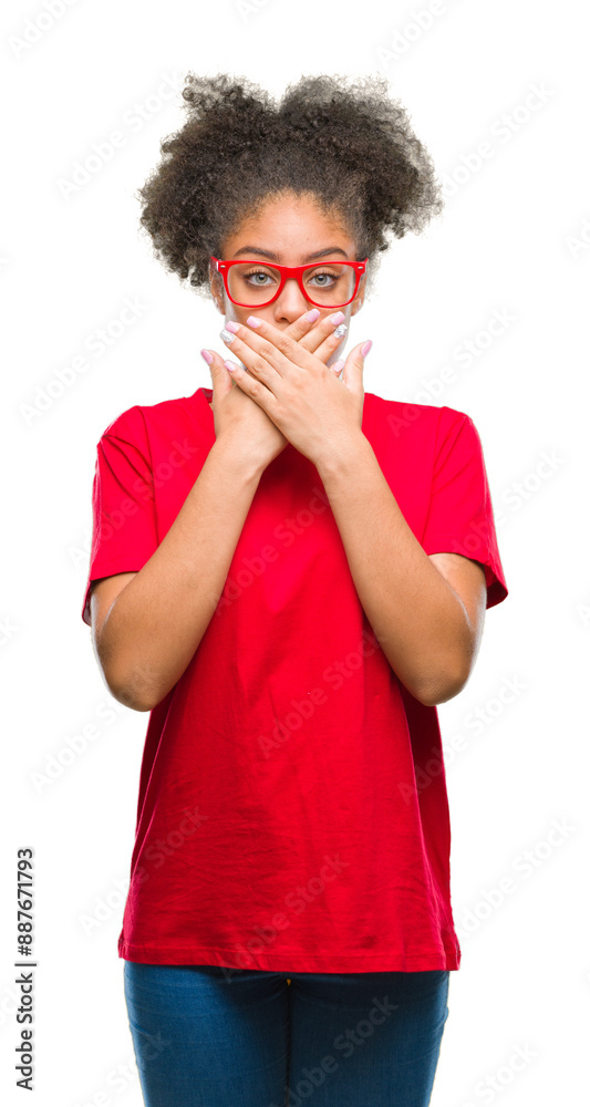 Young afro american woman wearing glasses over isolated background shocked covering mouth with hands for mistake. Secret concept. Young afro american woman wearing glasses over isolated background shocked covering mouth with hands for mistake. Secret concept.