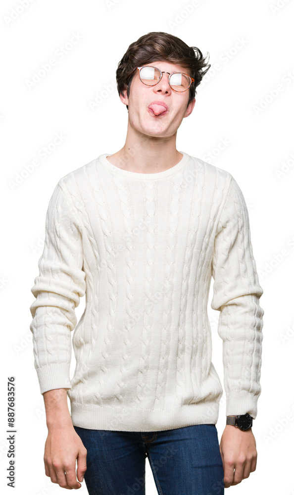 Obraz premium Young handsome man wearing glasses over isolated background sticking tongue out happy with funny expression. Emotion concept.