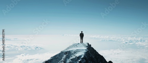  Businessman standing on a mountain summit 