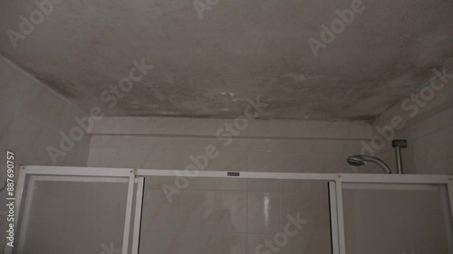 Tuzla, Istanbul, Turkey - 26th of February 2024: 4K Moldy ceiling above shower cabin in the bathroom
