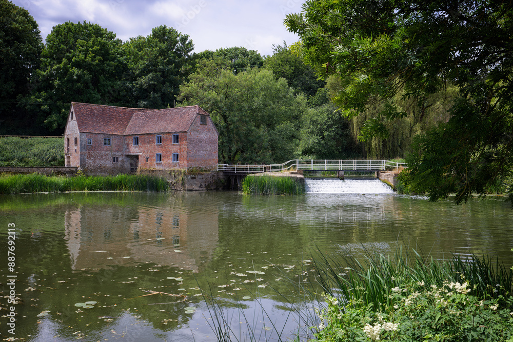 Fototapeta premium The Mill and Weir at Sturminster Newton on the river Stour in Dorset UK