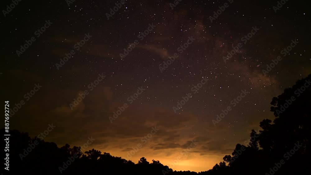 Time lapse of rising Milky Way, clouds passing