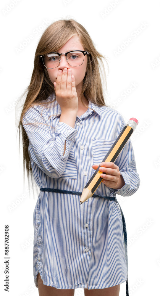 Young blonde child holding big pencil cover mouth with hand shocked with shame for mistake, expression of fear, scared in silence, secret concept Young blonde child holding big pencil cover mouth with hand shocked with shame for mistake, expression of fear, scared in silence, secret concept