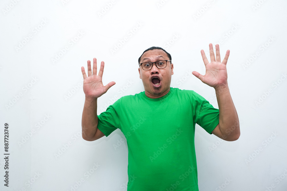 Wow, Funny face of Asian man. Shocked asian man isolate on white. Amazed and feels shocked asian man. Indonesian man with suprise expression. Wow, Funny face of Asian man. Shocked asian man isolate on white. Amazed and feels shocked asian man. Indonesian man with suprise expression.