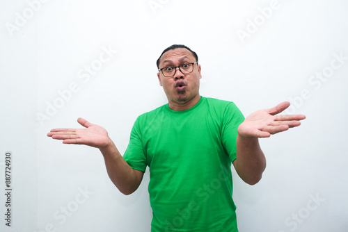 Adult Asian man showing shocked face expression isolated white backgroud photo