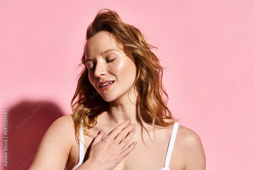 A captivating woman with natural beauty strikes a pose in a white bra. A captivating woman with natural beauty strikes a pose in a white bra.