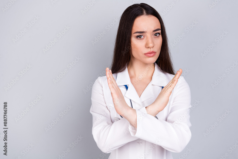 Photo of charming confident woman therapist wear white doctor robe stop sign empty space isolated on grey color background Photo of charming confident woman therapist wear white doctor robe stop sign empty space isolated on grey color background