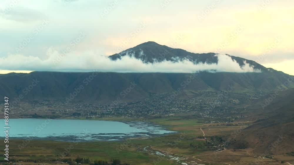 Stunning view on the mountain with a few single clouds and the blue lake in front, Tafi del Valle, Argentina, copy space and slow motion Stunning view on the mountain with a few single clouds and the blue lake in front, Tafi del Valle, Argentina, copy space and slow motion