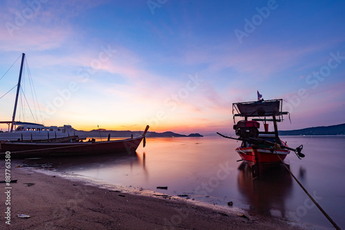 Longtail boats with Travel boats in tropical sea, Beautiful scenery morning sunrise or sunset sky over sea and mountain in phuket thailand, Amazing light of nature landscape Seascape photo