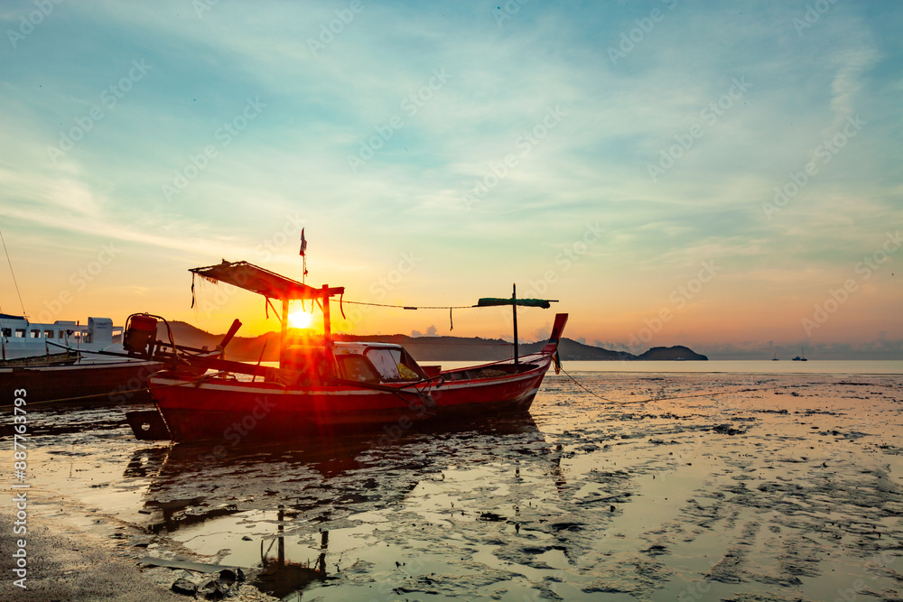 Fototapeta premium Longtail boats with Travel boats in tropical sea, Beautiful scenery morning sunrise or sunset sky over sea and mountain in phuket thailand, Amazing light of nature landscape Seascape