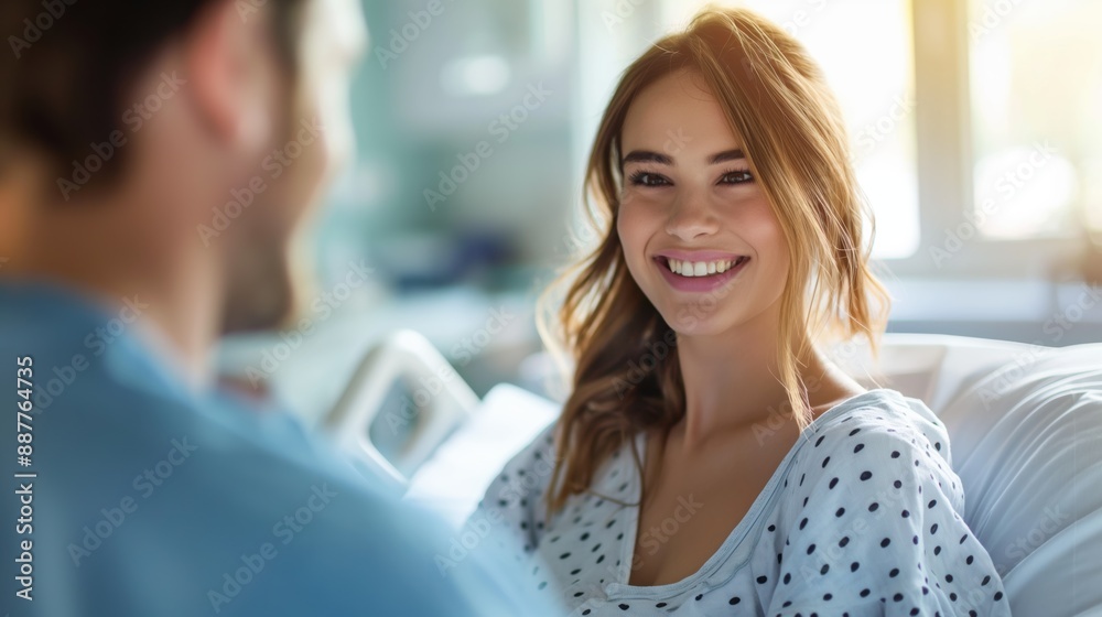 Pregnant woman with husband in a hospital room waiting for labor and delivery Pregnant woman with husband in a hospital room waiting for labor and delivery