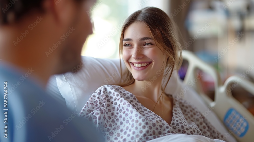 Pregnant woman with husband in a hospital room waiting for labor and delivery Pregnant woman with husband in a hospital room waiting for labor and delivery