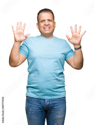 Middle age arab man wearing blue t-shirt over isolated background showing and pointing up with fingers number ten while smiling confident and happy.