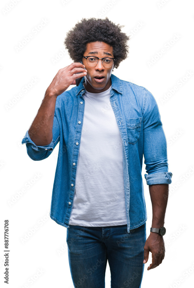 Afro american man talking on the phone over isolated background scared in shock with a surprise face, afraid and excited with fear expression Afro american man talking on the phone over isolated background scared in shock with a surprise face, afraid and excited with fear expression