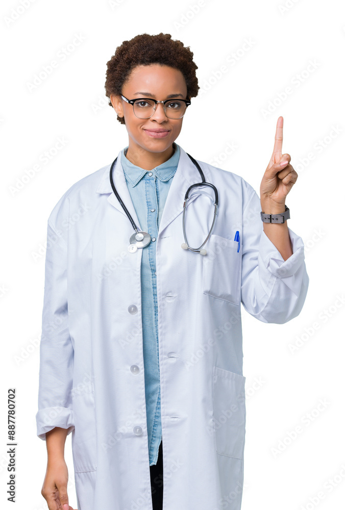 Young african american doctor woman wearing medical coat over isolated background showing and pointing up with finger number one while smiling confident and happy. Young african american doctor woman wearing medical coat over isolated background showing and pointing up with finger number one while smiling confident and happy.
