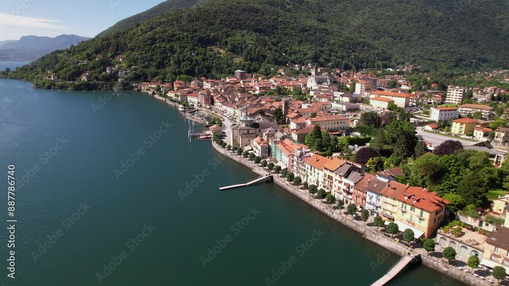 Town on Lake Maggiore filmed with a drone. The beautiful waterfront promenade invites you to stroll. Town on Lake Maggiore filmed with a drone. The beautiful waterfront promenade invites you to stroll.