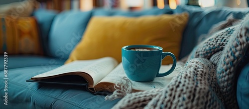 A blue coffee cup on the so...