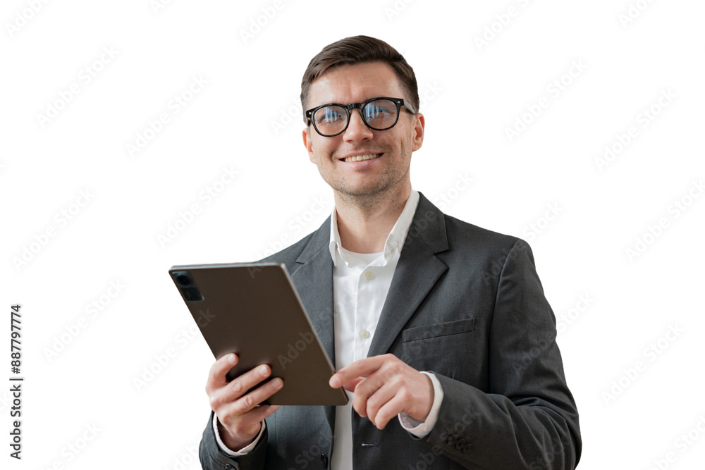 A male businessman manager uses a tablet computer in the office. Cut out A male businessman manager uses a tablet computer in the office. Cut out
