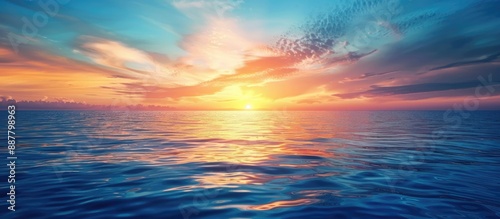 A stunning blue and orange sky at sea is captured as a background for design with abundant copy space image © vxnaghiyev
