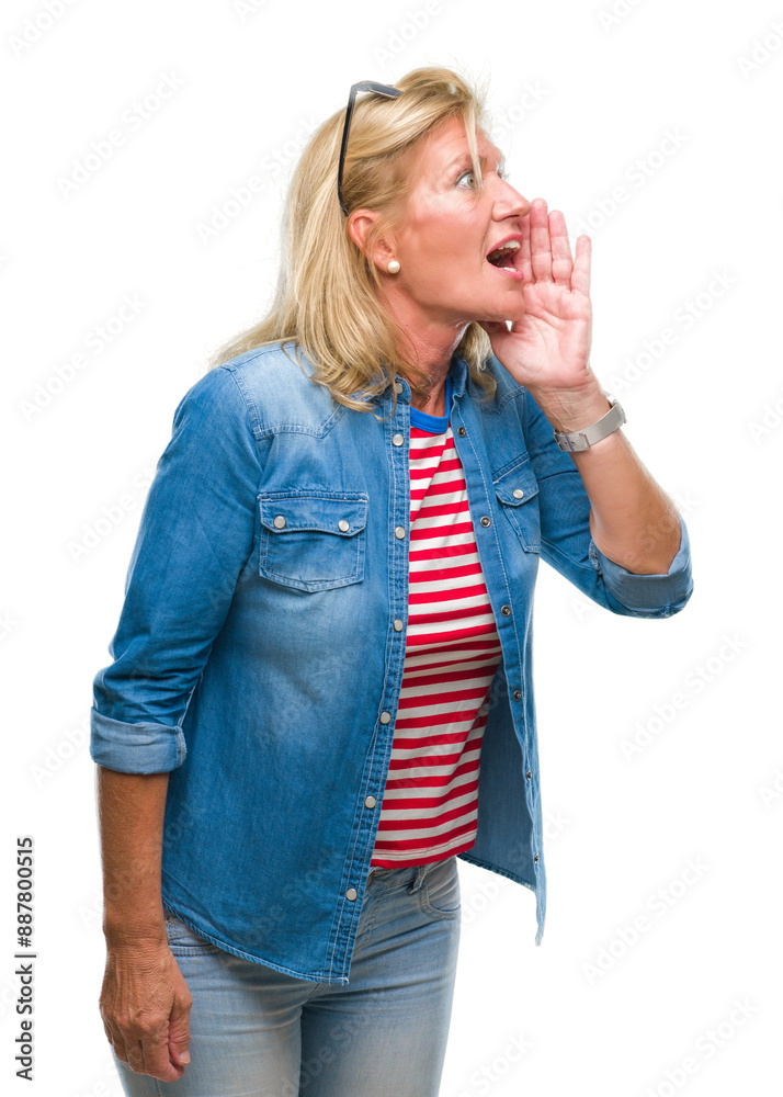 Middle age blonde woman over isolated background shouting and screaming loud to side with hand on mouth. Communication concept. Middle age blonde woman over isolated background shouting and screaming loud to side with hand on mouth. Communication concept.