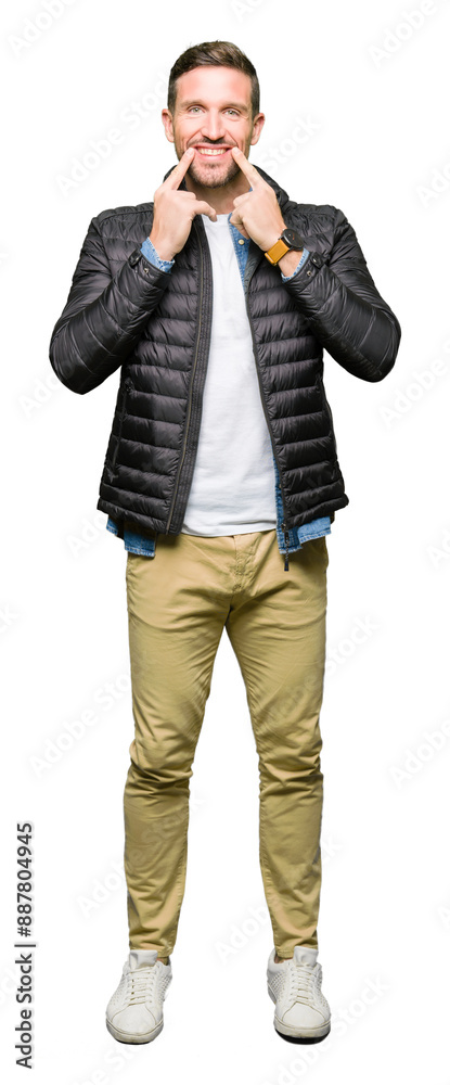 Handsome man wearing winter coat Smiling with open mouth, fingers pointing and forcing cheerful smile Handsome man wearing winter coat Smiling with open mouth, fingers pointing and forcing cheerful smile