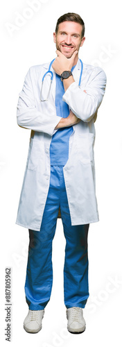 Handsome doctor man wearing medical uniform over isolated background looking confident at the camera with smile with crossed arms and hand raised on chin. Thinking positive.