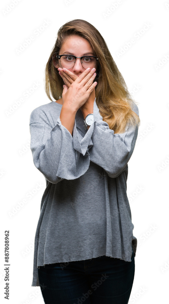 Young beautiful blonde woman wearing glasses over isolated background shocked covering mouth with hands for mistake. Secret concept. Young beautiful blonde woman wearing glasses over isolated background shocked covering mouth with hands for mistake. Secret concept.