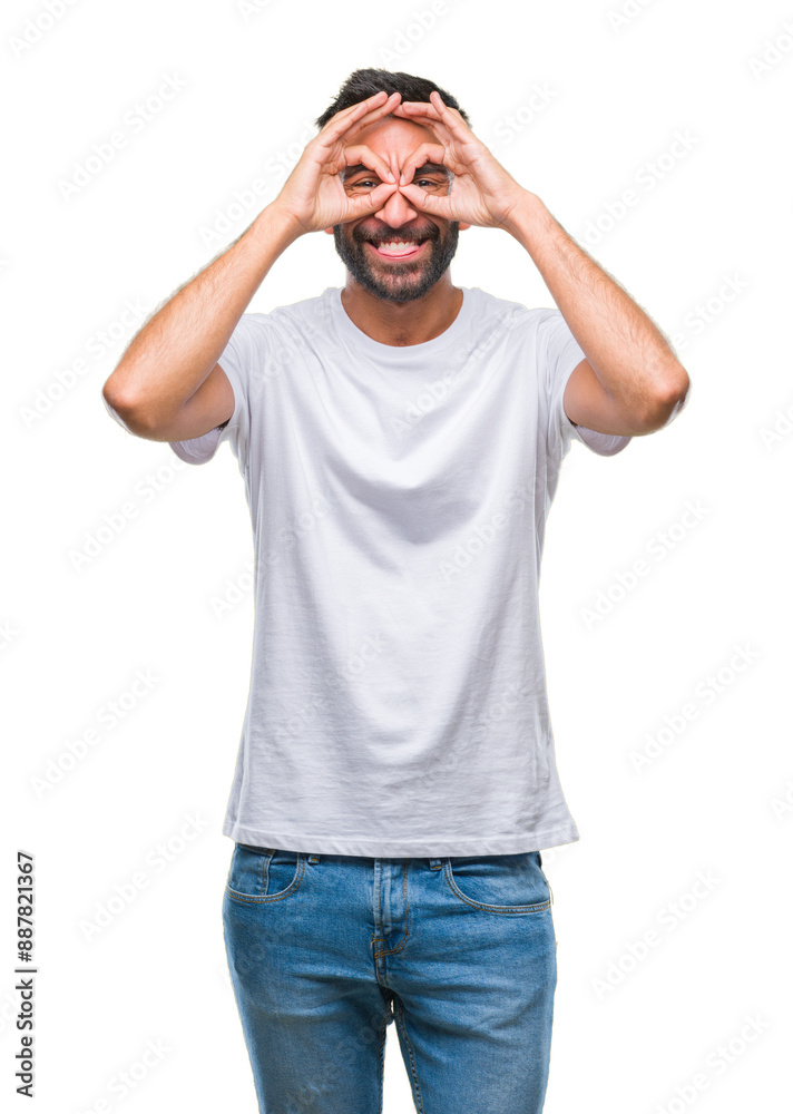 Adult hispanic man over isolated background doing ok gesture like binoculars sticking tongue out, eyes looking through fingers. Crazy expression. Adult hispanic man over isolated background doing ok gesture like binoculars sticking tongue out, eyes looking through fingers. Crazy expression.