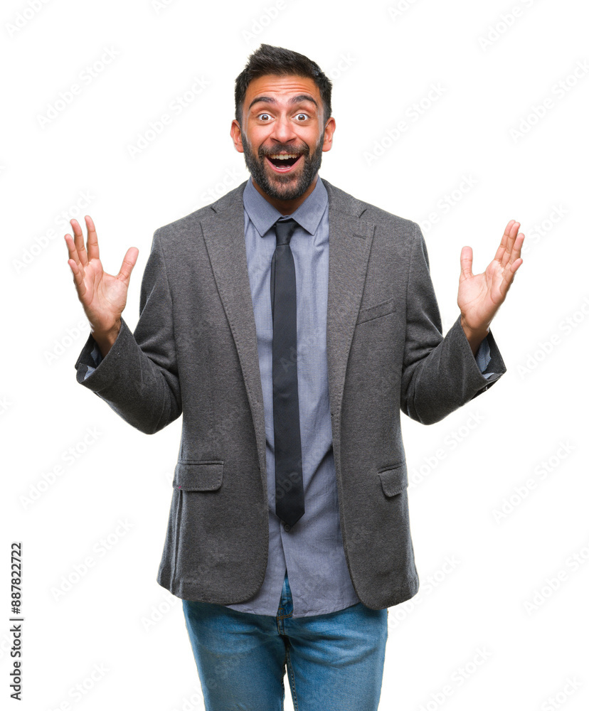 Adult hispanic business man over isolated background celebrating crazy and amazed for success with arms raised and open eyes screaming excited. Winner concept Adult hispanic business man over isolated background celebrating crazy and amazed for success with arms raised and open eyes screaming excited. Winner concept
