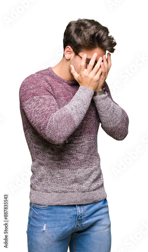 Young handsome man wearing glasses over isolated background with sad expression covering face with hands while crying. Depression concept.