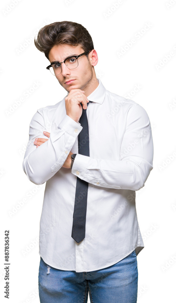 Young business man wearing glasses over isolated background with hand on chin thinking about question, pensive expression. Smiling with thoughtful face. Doubt concept. Young business man wearing glasses over isolated background with hand on chin thinking about question, pensive expression. Smiling with thoughtful face. Doubt concept.