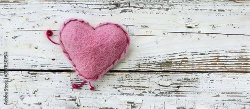 A pink felt heart handmade ...