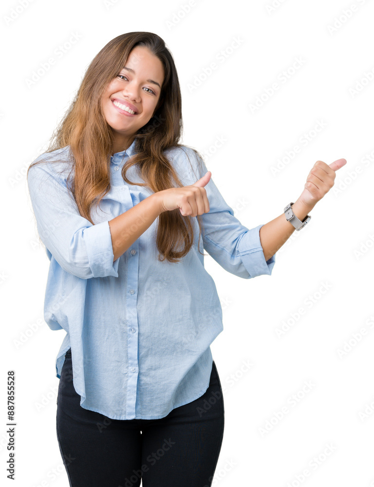 Young beautiful brunette business woman over isolated background Pointing to the back behind with hand and thumbs up, smiling confident Young beautiful brunette business woman over isolated background Pointing to the back behind with hand and thumbs up, smiling confident