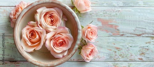 Fresh roses in a bowl of wa...