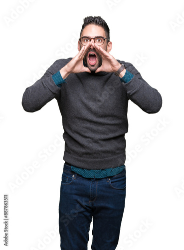 Young handsome man wearing glasses over isolated background Shouting angry out loud with hands over mouth