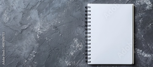 Spiral notebook on grey bac...