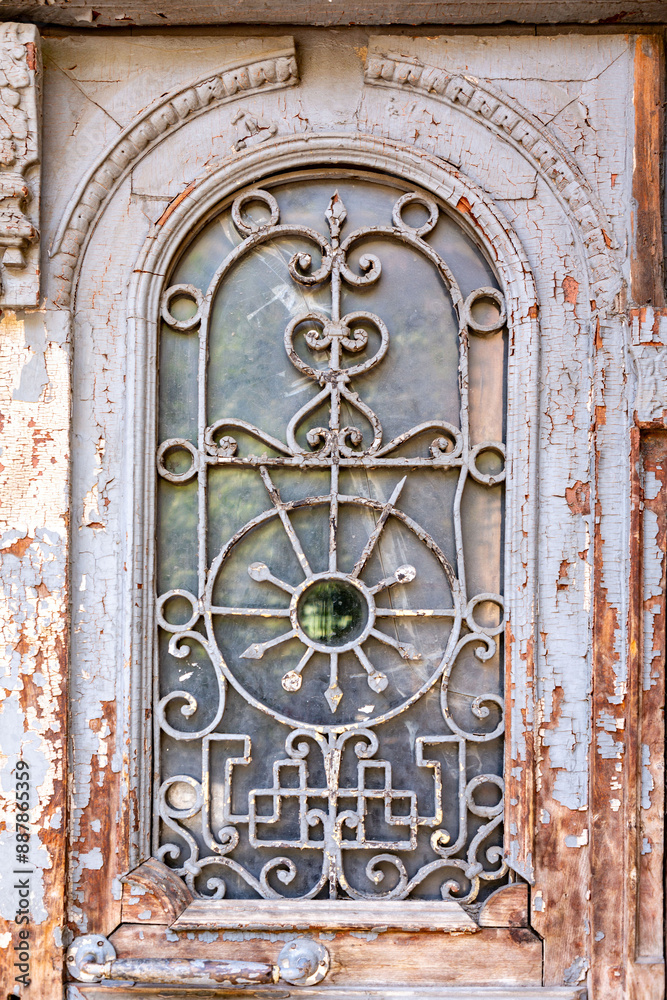 Detail from an ornate shabby style window of a historical building Detail from an ornate shabby style window of a historical building