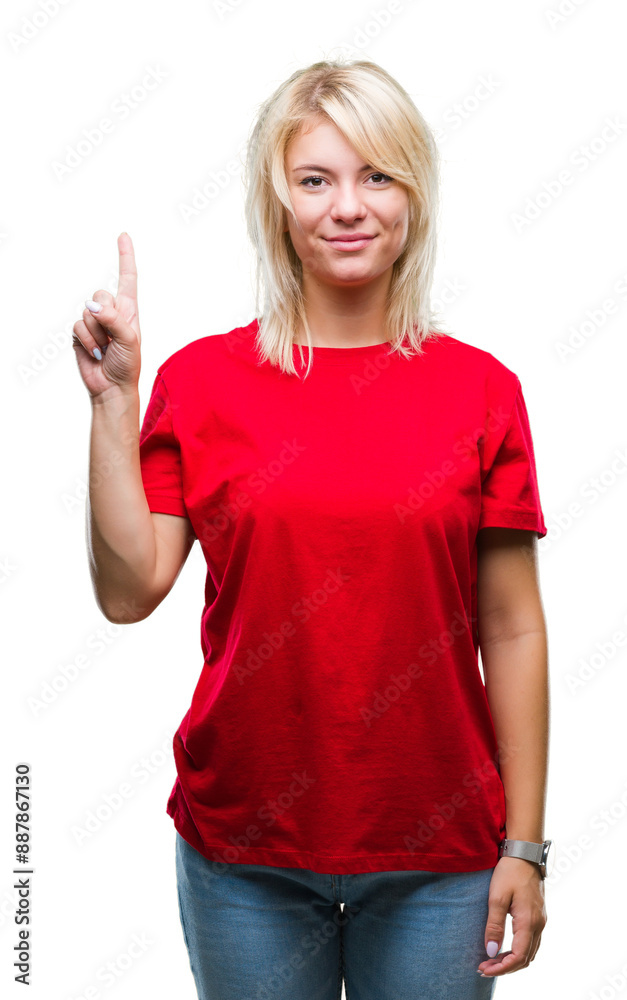 Young beautiful blonde woman wearing red t-shirt over isolated background showing and pointing up with finger number one while smiling confident and happy. Young beautiful blonde woman wearing red t-shirt over isolated background showing and pointing up with finger number one while smiling confident and happy.
