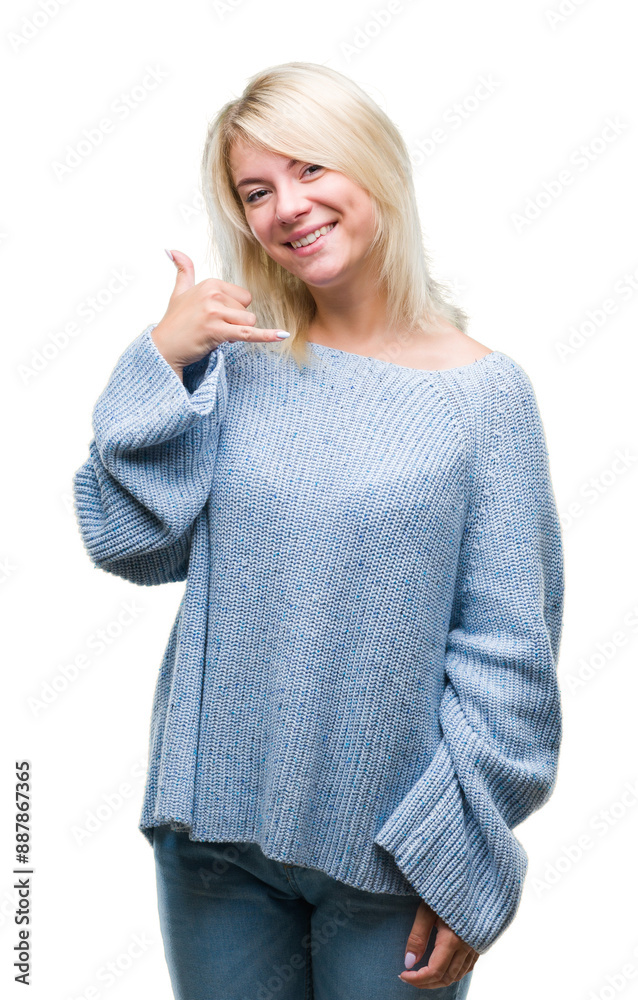 Young beautiful blonde woman wearing winter sweater over isolated background smiling doing phone gesture with hand and fingers like talking on the telephone. Communicating concepts. Young beautiful blonde woman wearing winter sweater over isolated background smiling doing phone gesture with hand and fingers like talking on the telephone. Communicating concepts.