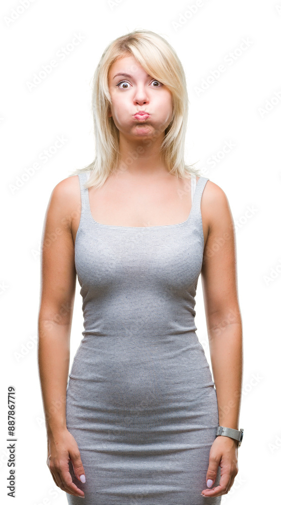Young beautiful blonde woman over isolated background puffing cheeks with funny face. Mouth inflated with air, crazy expression. Young beautiful blonde woman over isolated background puffing cheeks with funny face. Mouth inflated with air, crazy expression.