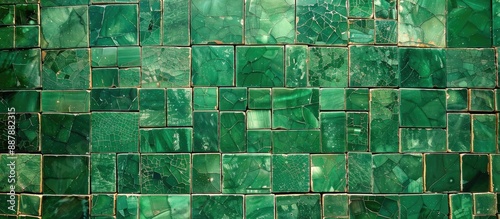 A mosaic of green tiles creating a textured pattern with copy space image © vxnaghiyev