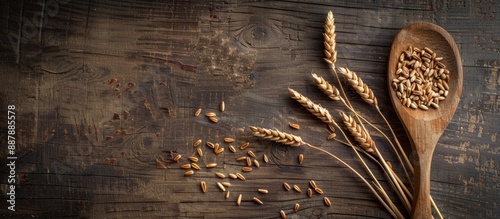 A wooden spoon with wheat g...