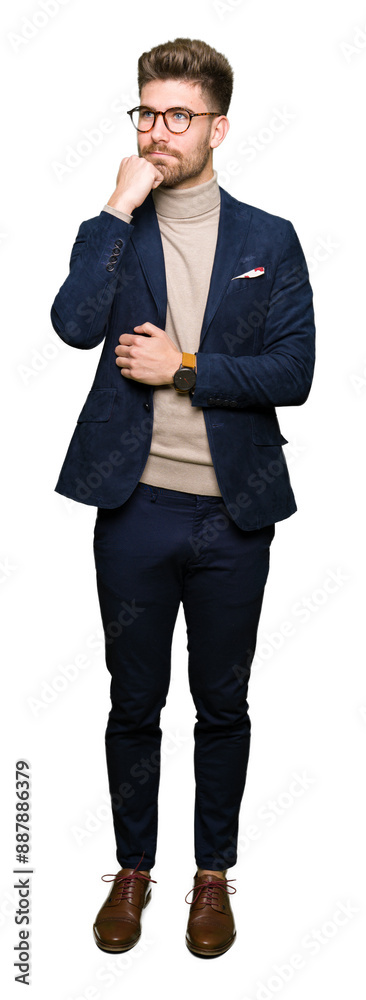 Young handsome business man wearing glasses with hand on chin thinking about question, pensive expression. Smiling with thoughtful face. Doubt concept. Young handsome business man wearing glasses with hand on chin thinking about question, pensive expression. Smiling with thoughtful face. Doubt concept.