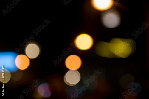 Abstract circular bokeh background of city night light, defocused