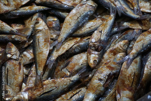 Dried sardines are displayed and being sold on a dry fish market, Salted sardines are on sale at a local Asian seafood market, Closeup shot of freshly caught dried seafood