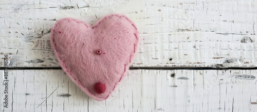 A pink felt heart handmade ...
