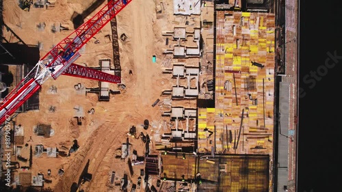Aerial view of a construction site with crane and foundation work, urban development, architecture, construction project