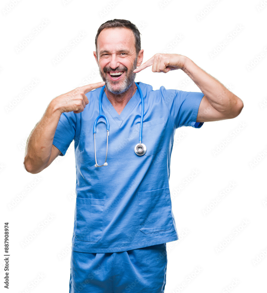 Middle age hoary senior doctor man wearing medical uniform over isolated background smiling confident showing and pointing with fingers teeth and mouth. Health concept. Middle age hoary senior doctor man wearing medical uniform over isolated background smiling confident showing and pointing with fingers teeth and mouth. Health concept.